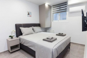 Brand-New Urban Getaway Steps from Megaro Mousikis